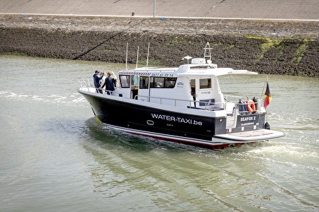 black and white boat on Blankenberge harbor channel