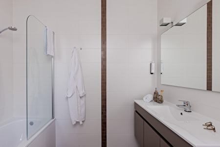 Bathroom with a shower in the bath